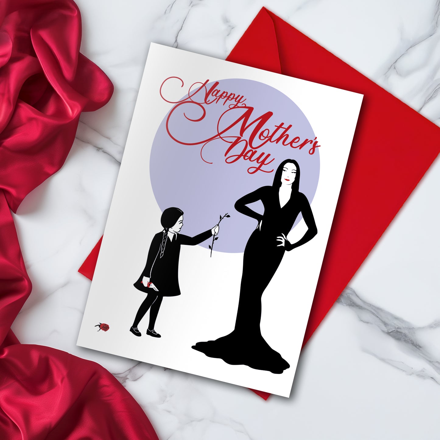 Large A5 glossy Mother’s Day card featuring Wednesday Addams giving Morticia a headless rose, with Pugsley causing mischief on the back. Includes red envelope and blank interior, perfect for spooky, gothic, and alternative mums.