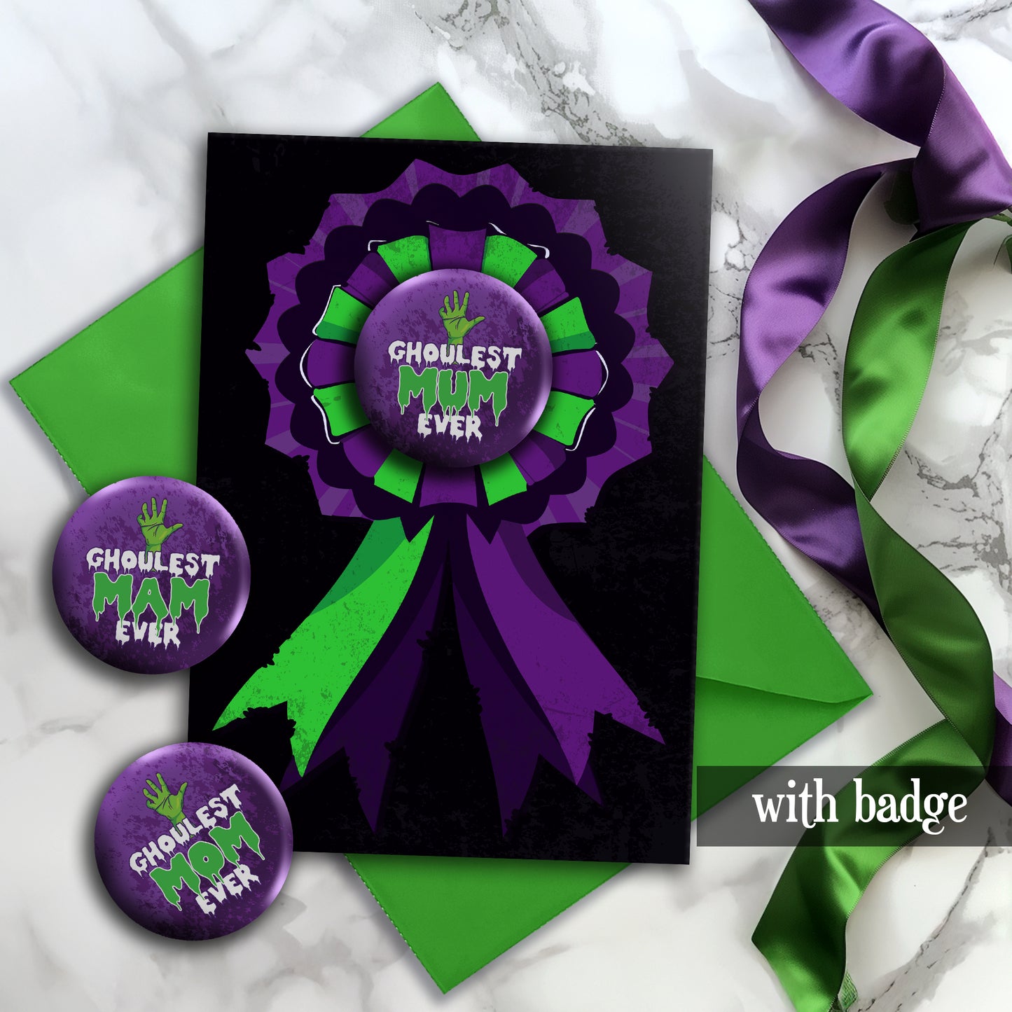 A large glossy A5 greeting card featuring a green and purple rosette with a removable 58mm badge reading "Ghoulest Mom Ever" in a bold, spooky font. Available in Mom, Mum, or Mam variations. The card is blank inside and comes with an envelope.
