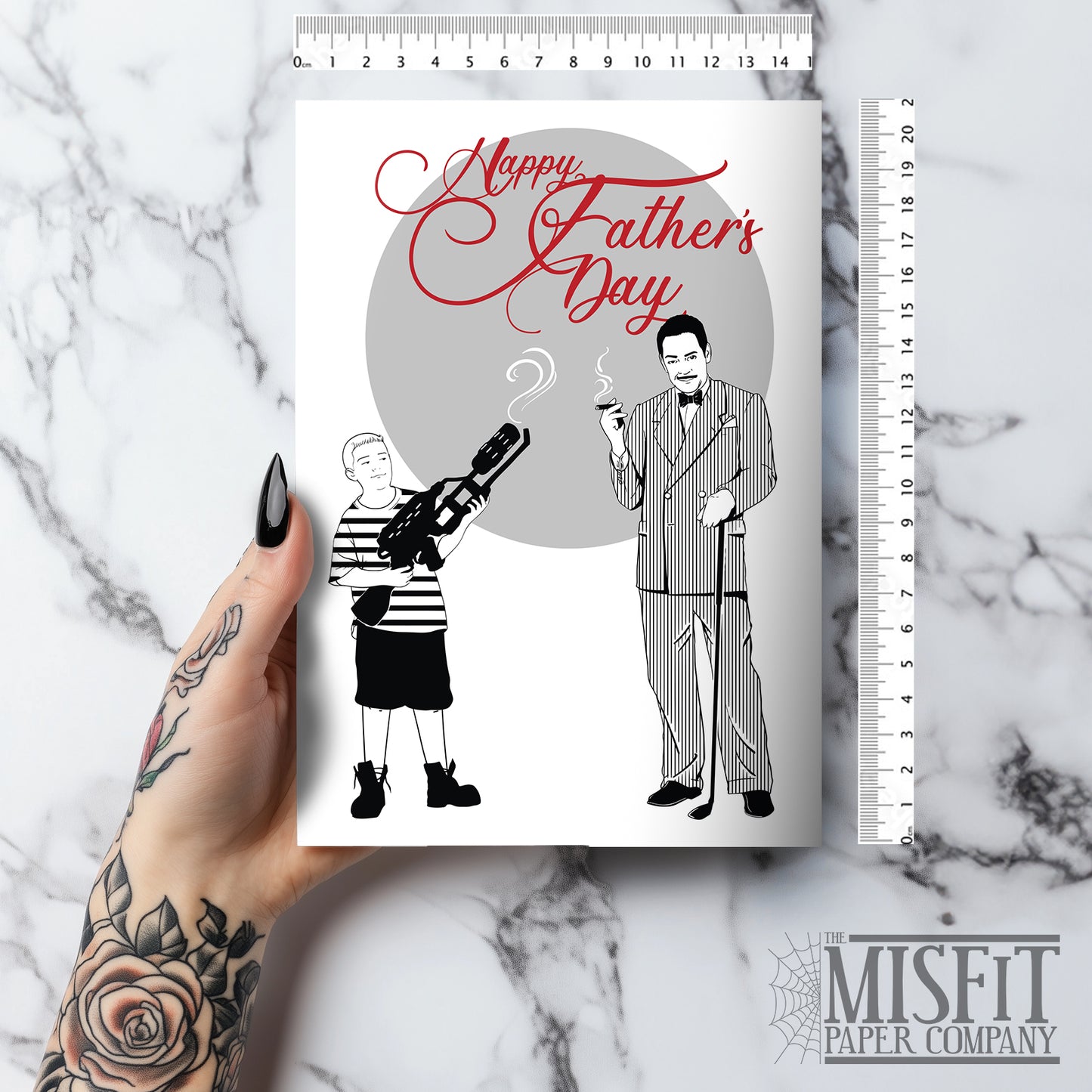 Gothic Father’s Day card featuring Gomez Addams with Pugsley holding a weapon, and Wednesday Addams illustration on the back. Includes red envelope. A5 size with gothic family humour for Wednesday fans and spooky alternative dads.