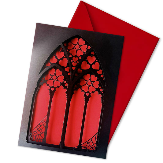 Handmade A5 black greeting card with layered gothic arch design and red heart cut-out revealing soft pink interior. Blank inside with envelope included. Perfect for gothic weddings, anniversaries, or alternative Valentine’s Day.
