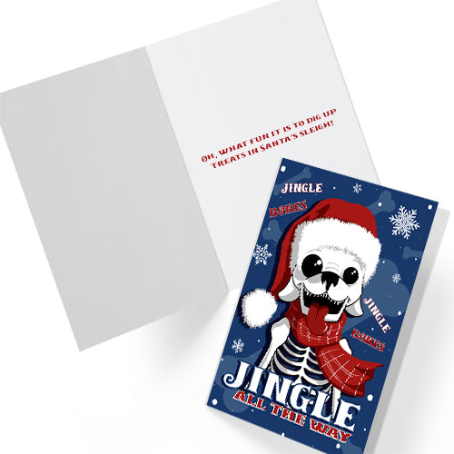 A5 glossy portrait Christmas card with cartoon skeleton dog wearing Santa hat and red scarf on dark blue background, snowflakes and “Jingle Bones” and "Jingle All The Way" text. Includes red envelope. Inside the lyric is completed with "Oh what fun it is to dig up treats in Santa's sleigh".