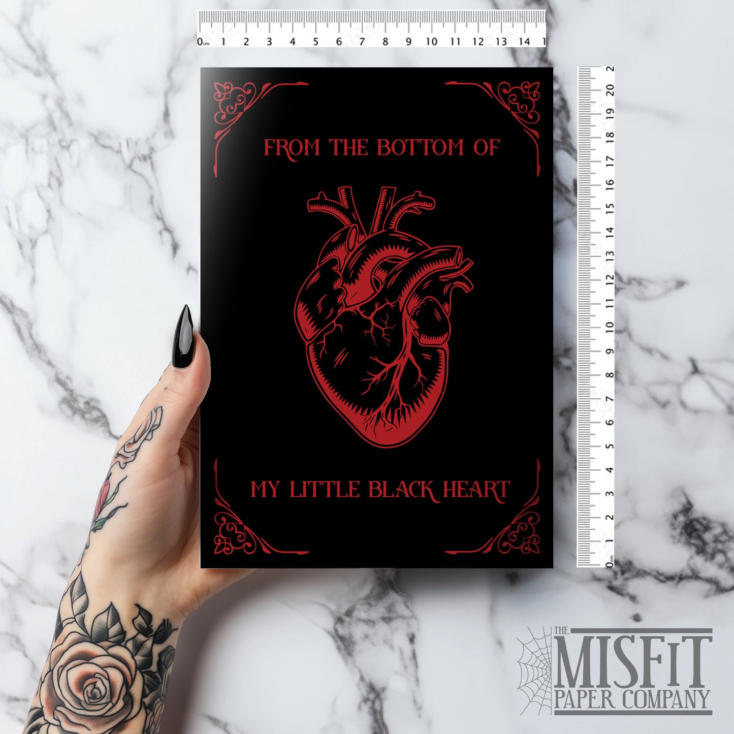 Glossy black A5 card with a lifelike red Victorian heart illustration. Text says “From the Bottom of My Little Black Heart.” Includes envelope. Perfect for goth and alternative romance.