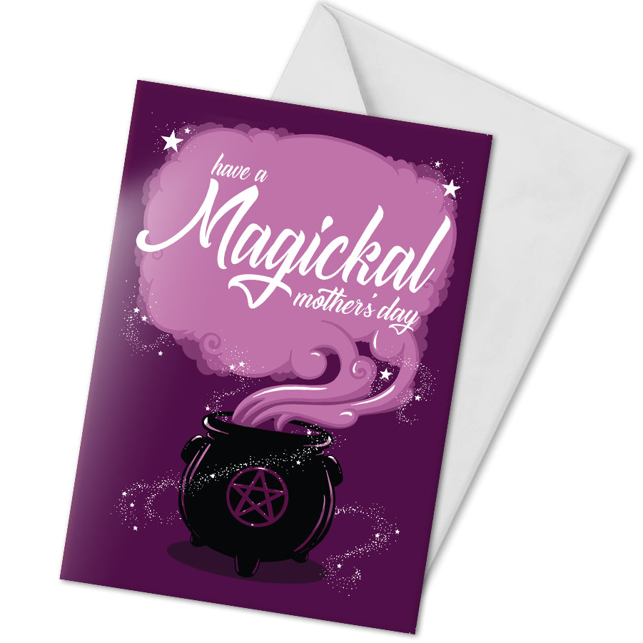 A large A5 greeting card in purple or pink, featuring a witchy cauldron illustration with billowing sparkling clouds and the words "Have a Magickal Mother’s Day." The inside has an illustration only (no text). Comes with an envelope included.