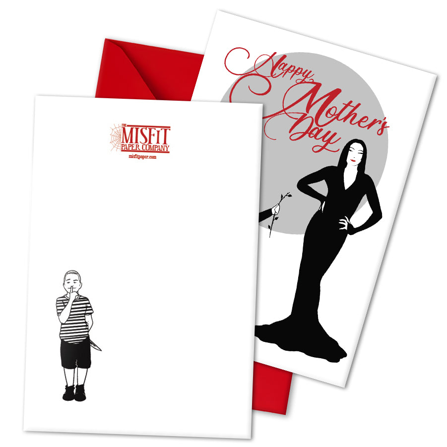 Large A5 glossy Mother’s Day card featuring Wednesday Addams giving Morticia a headless rose, with Pugsley causing mischief on the back. Includes red envelope and blank interior, perfect for spooky, gothic, and alternative mums.