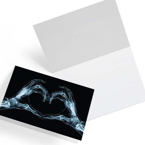 Large A5 gothic greeting card with a skeleton X-ray image of two hands forming a heart on a glossy black background. Blank inside, with envelope included. Ideal for alternative Valentine’s Day, anniversaries, or dark romance gestures.