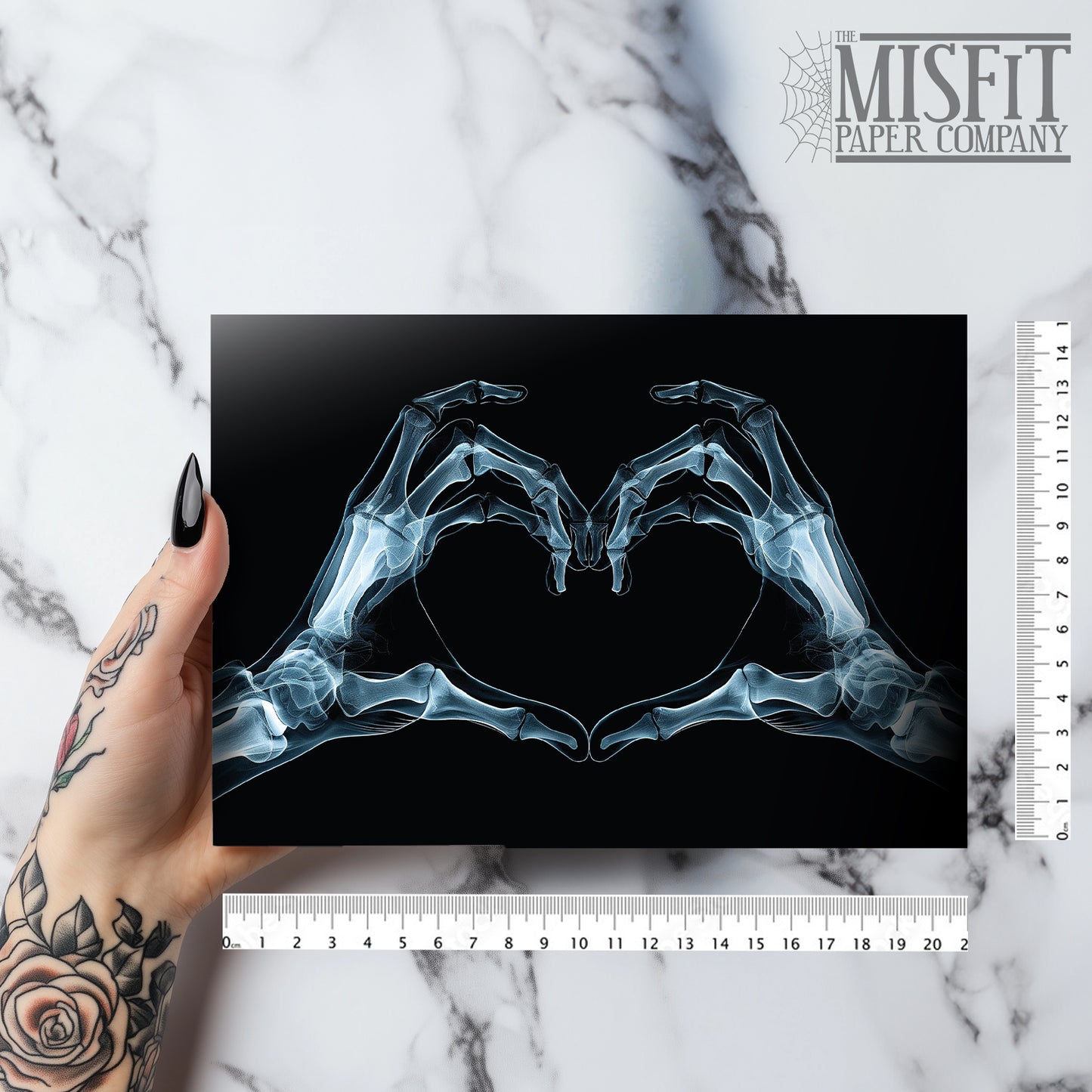 Large A5 gothic greeting card with a skeleton X-ray image of two hands forming a heart on a glossy black background. Blank inside, with envelope included. Ideal for alternative Valentine’s Day, anniversaries, or dark romance gestures.