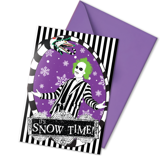 A5 glossy portrait Christmas card with black and white striped frame, purple background and snowflakes. Green-haired Beetlejuice in pinstripe suit, sandworm at top, banner reads “It’s Snow Time!”. Includes purple envelope. Blank inside.