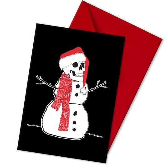 A5 glossy portrait Christmas card with white snowman on black background, skull head wearing a Santa hat and patterned red scarf, stick arms and coal buttons. Clean graphic style. Includes red envelope. Blank inside.