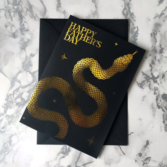 Handmade gothic Father’s Day card with foil snake design on black cardstock, available in gold or silver with coloured interiors, perfect for alternative dads.