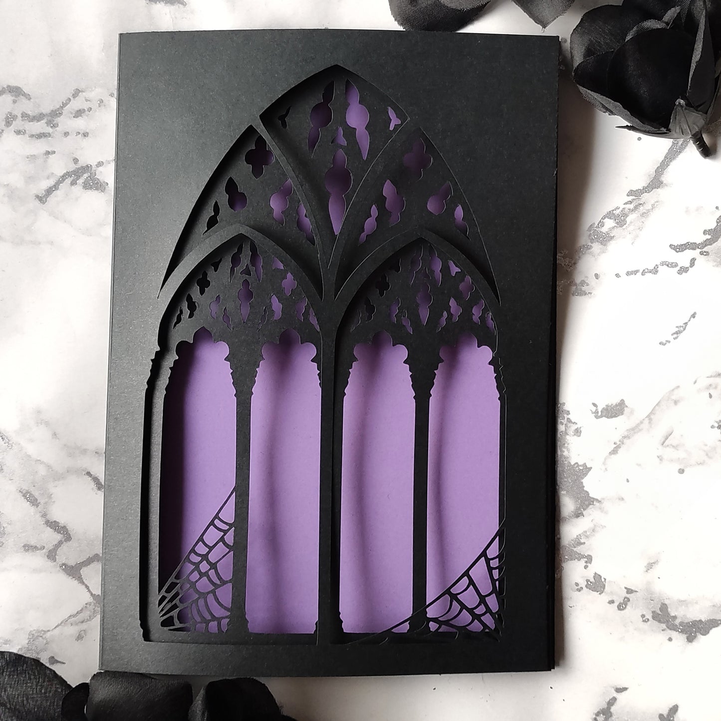 black, triple layered greeting card with a cut-out gothic arch design. available in purple, red and heart motif. perfect for weddings, anniversaries and birthdays, also as a framed keepsake.