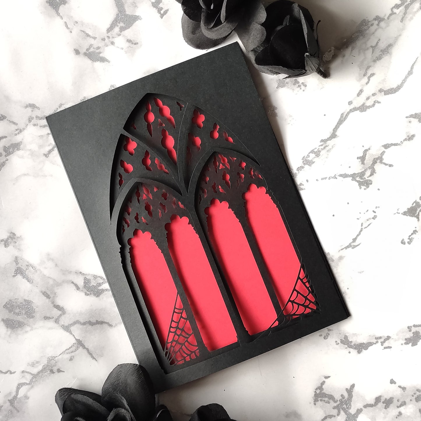 black, triple layered greeting card with a cut-out gothic arch design. available in purple, red and heart motif. perfect for weddings, anniversaries and birthdays, also as a framed keepsake.