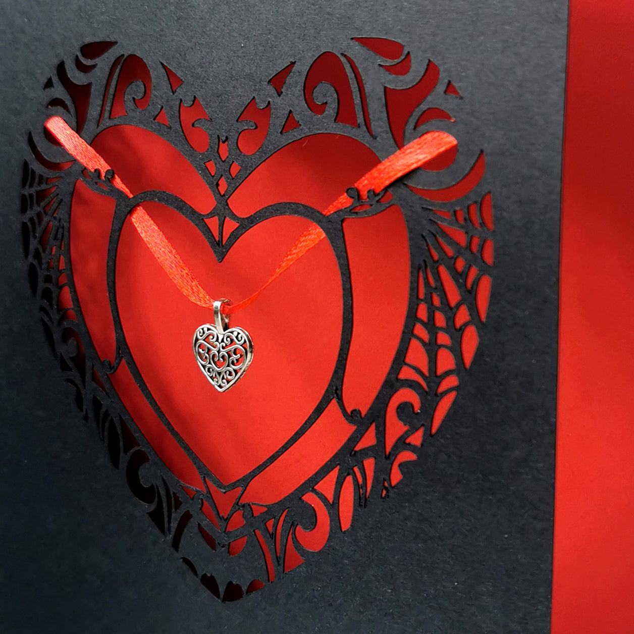 A collection of handmade gothic greeting cards featuring foil, charms, and cut-outs. Unique designs for alternative birthdays, love, and spooky occasions.