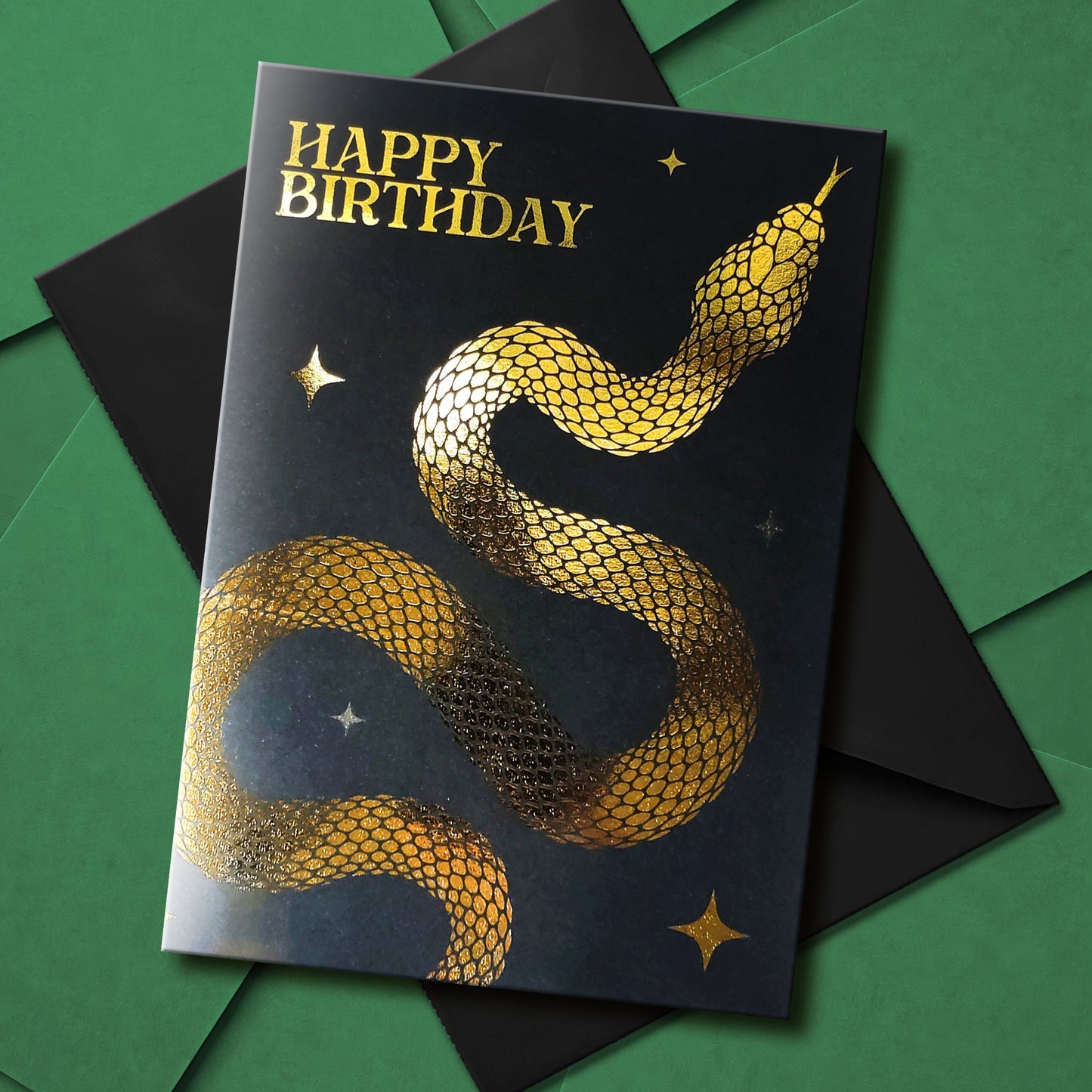 Handmade gothic birthday card with metallic foil snake design on black cardstock, available in gold or silver with coloured interiors and matching envelope.
