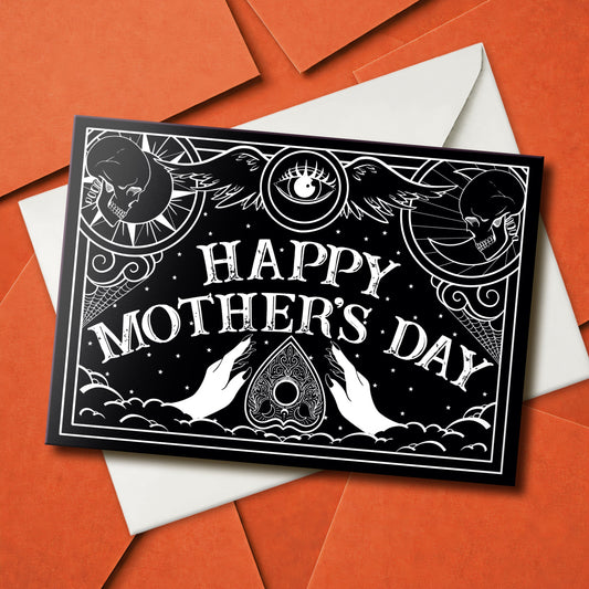 Gothic Mother’s Day card with black and white Ouija board design and ornate planchette details, blank inside with illustrated interior and matching envelope.