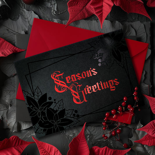 A5 landscape handmade Christmas card on black with red foil “Season’s Greetings” lettering and black foil poinsettia and holly motifs in the corners. Subtle border lines. Includes red envelope. Blank inside.