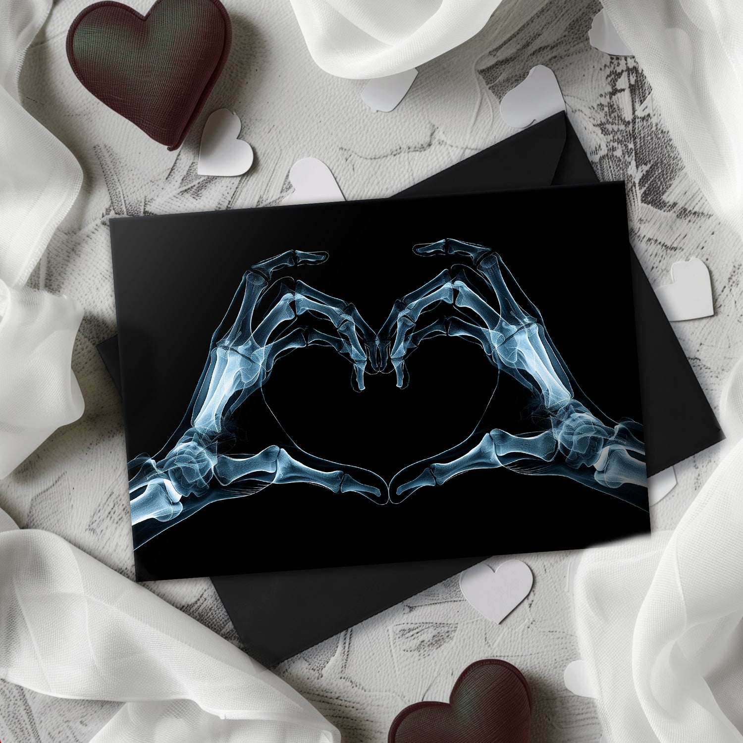 Large A5 gothic greeting card with a skeleton X-ray image of two hands forming a heart on a glossy black background. Blank inside, with envelope included. Ideal for alternative Valentine’s Day, anniversaries, or dark romance gestures.
