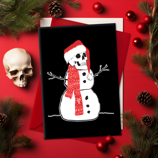 A5 glossy portrait Christmas card with white snowman on black background, skull head wearing a Santa hat and patterned red scarf, stick arms and coal buttons. Clean graphic style. Includes red envelope. Blank inside.