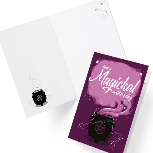 A large A5 greeting card in purple or pink, featuring a witchy cauldron illustration with billowing sparkling clouds and the words "Have a Magickal Mother’s Day." The inside has an illustration only (no text). Comes with an envelope included.
