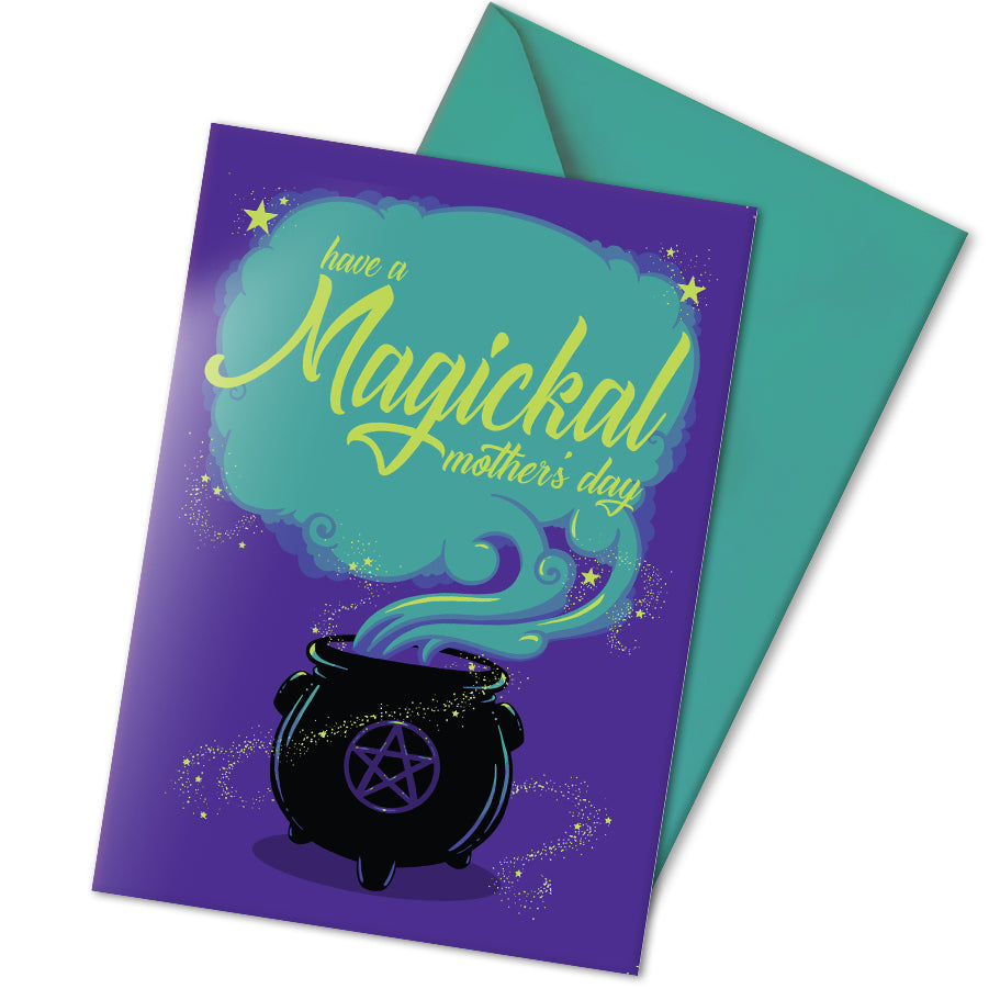 A large A5 greeting card in purple or pink, featuring a witchy cauldron illustration with billowing sparkling clouds and the words "Have a Magickal Mother’s Day." The inside has an illustration only (no text). Comes with an envelope included.