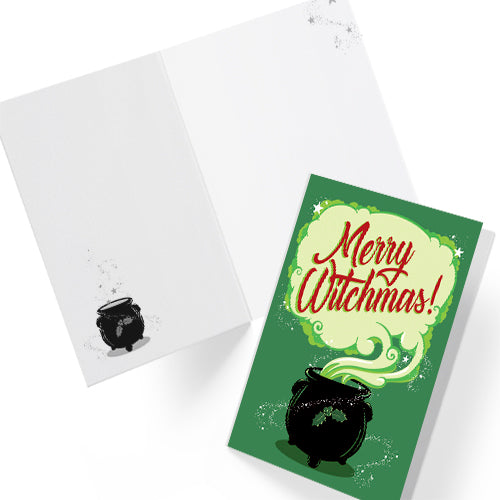 A large glossy greeting card reading "Merry Witchmas" in red, on a pale cloud of smoke from a black cauldron, all on a green background. Comes with a festive red envelope. Ideal for alternative christmas holiday.
