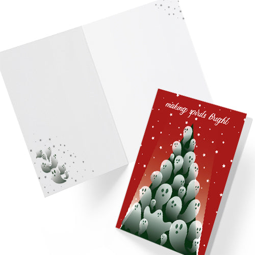 A5 glossy portrait Christmas card with red background and starry sky. Green tree flooded with semi-transparent ghosts, white script text “making spirits bright”. Small ghost and stars print inside. Includes red envelope. Blank area for message.