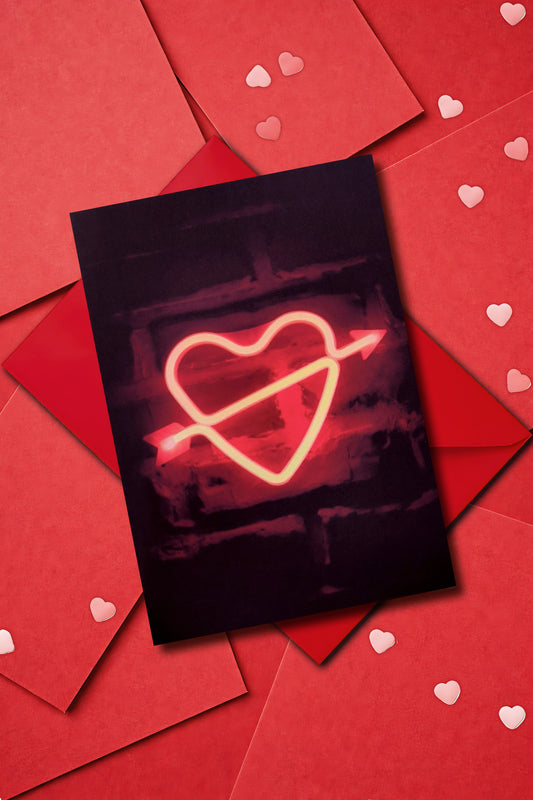 A5 Valentine card with a red neon heart graphic glowing on a black background. Minimal gothic style. Portrait format, blank inside, includes envelope.