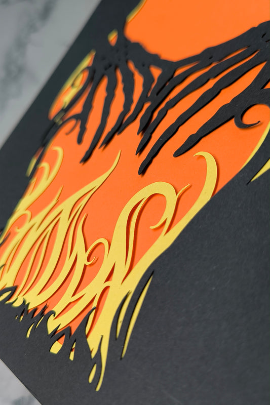 Layered papercut artwork of two skeleton hands reaching through yellow flames over an orange background, with the words I Will Follow You in gold foil lettering. 8 x 10 inches. frame not included.