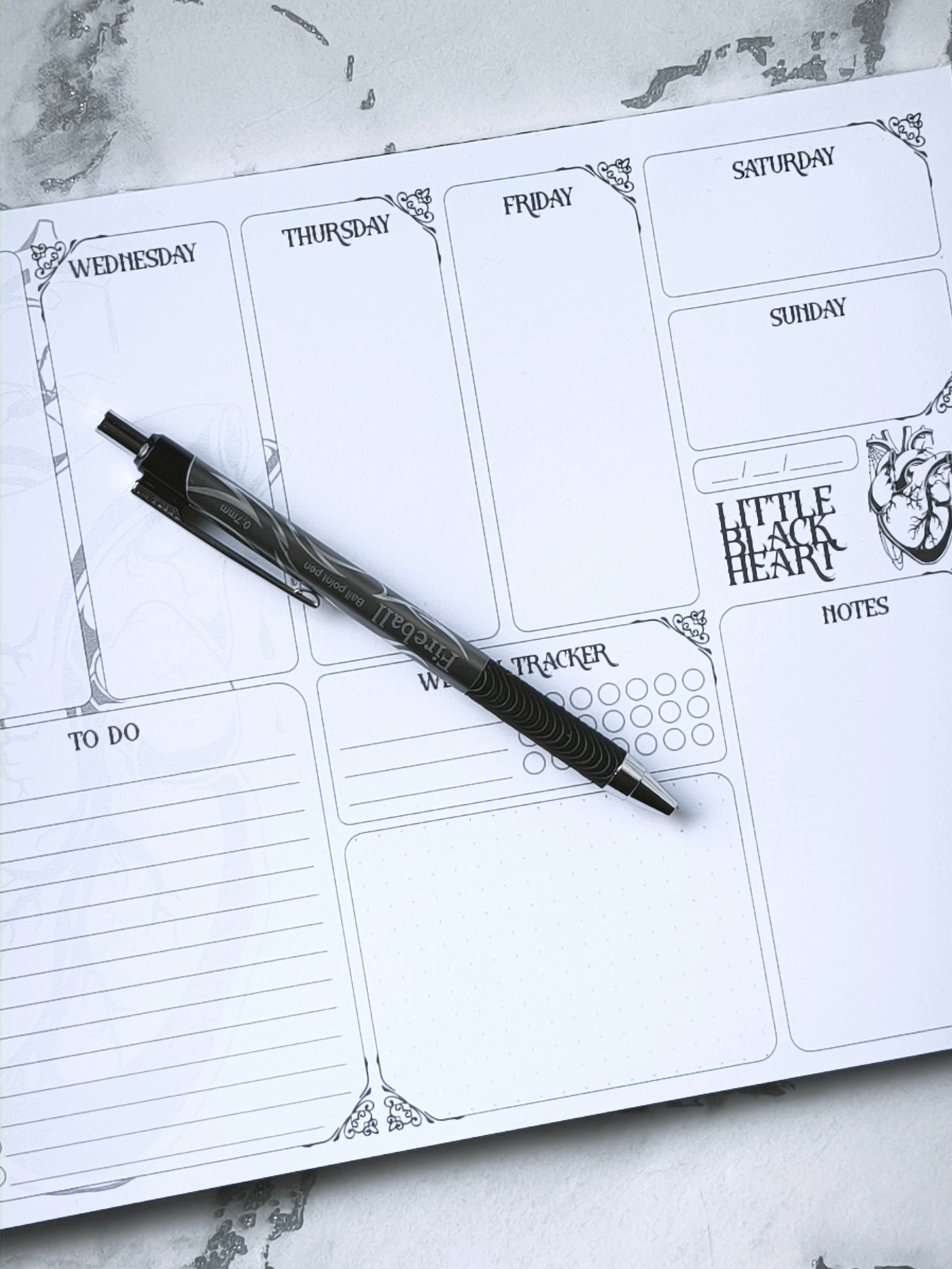 A4 undated weekly planner pad with gothic headings. Large daily boxes, to-do list, notes area, dotted section and habit tracker circles. Monochrome layout on smooth tear-off desk pad.