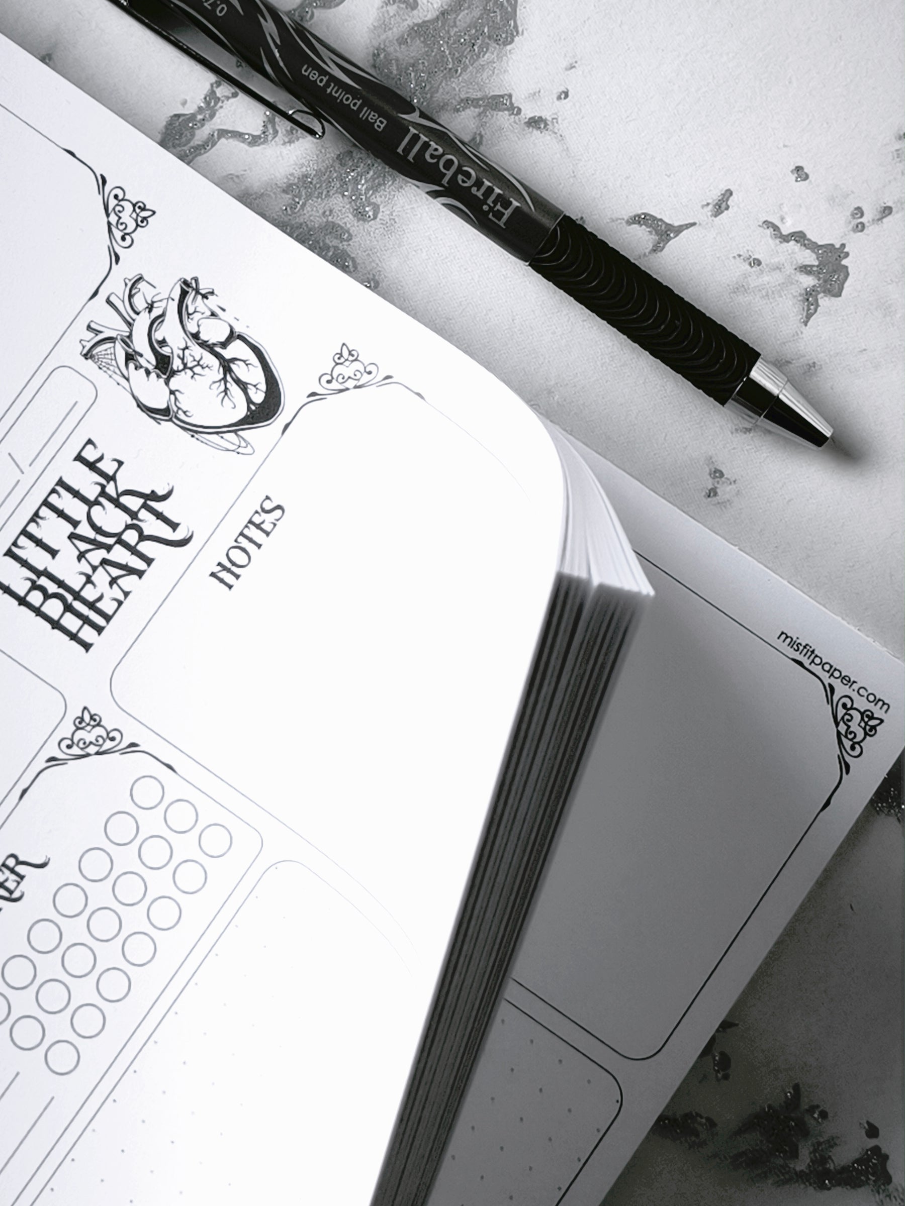 A4 undated weekly planner pad with gothic headings. Large daily boxes, to-do list, notes area, dotted section and habit tracker circles. Monochrome layout on smooth tear-off desk pad.