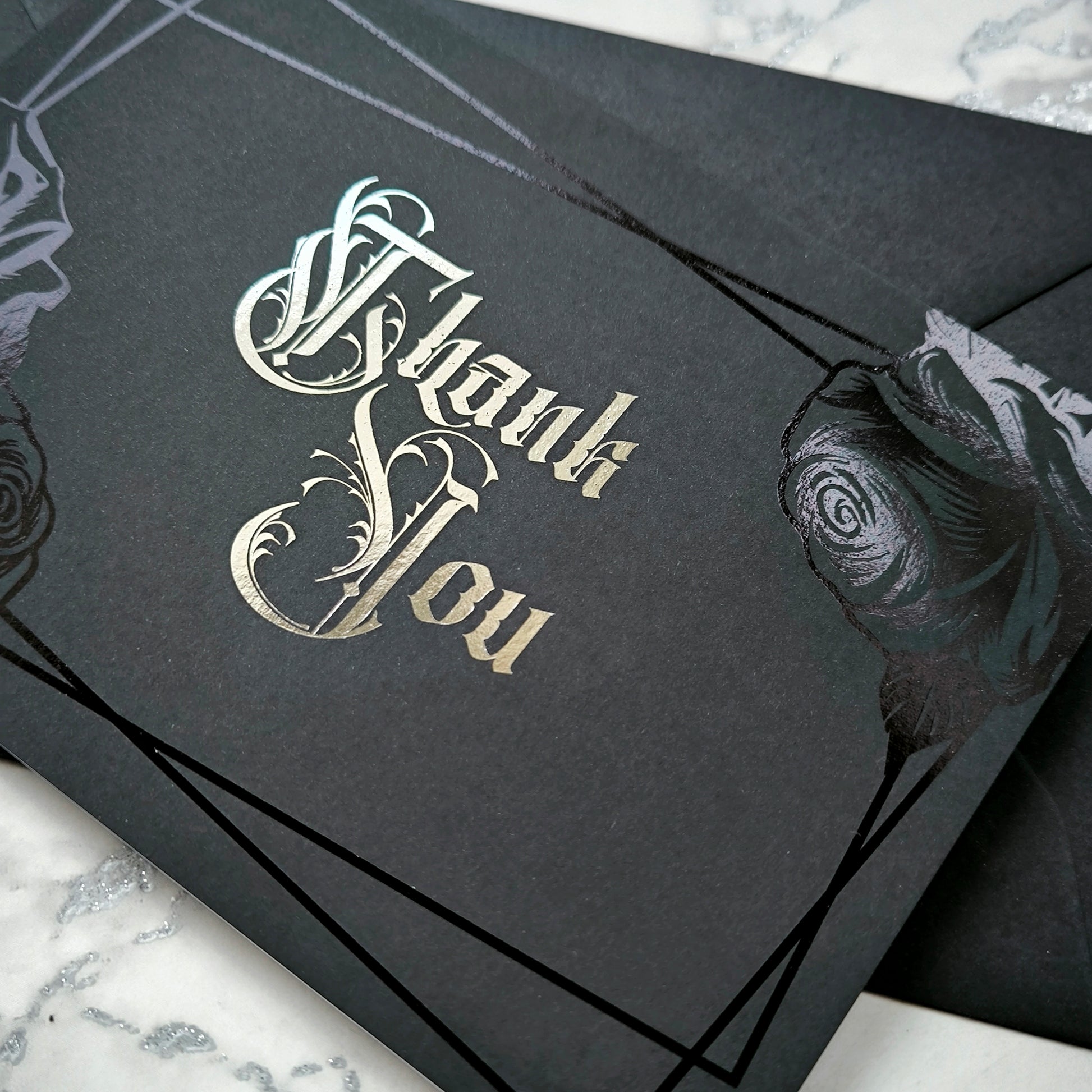 Handmade gothic thank you card with black rose foil and silver Victorian lettering. Blank inside, perfect for gothic, emo, dark fantasy, or horror lovers, it’s a striking alternative to the usual plain thank-you notes.