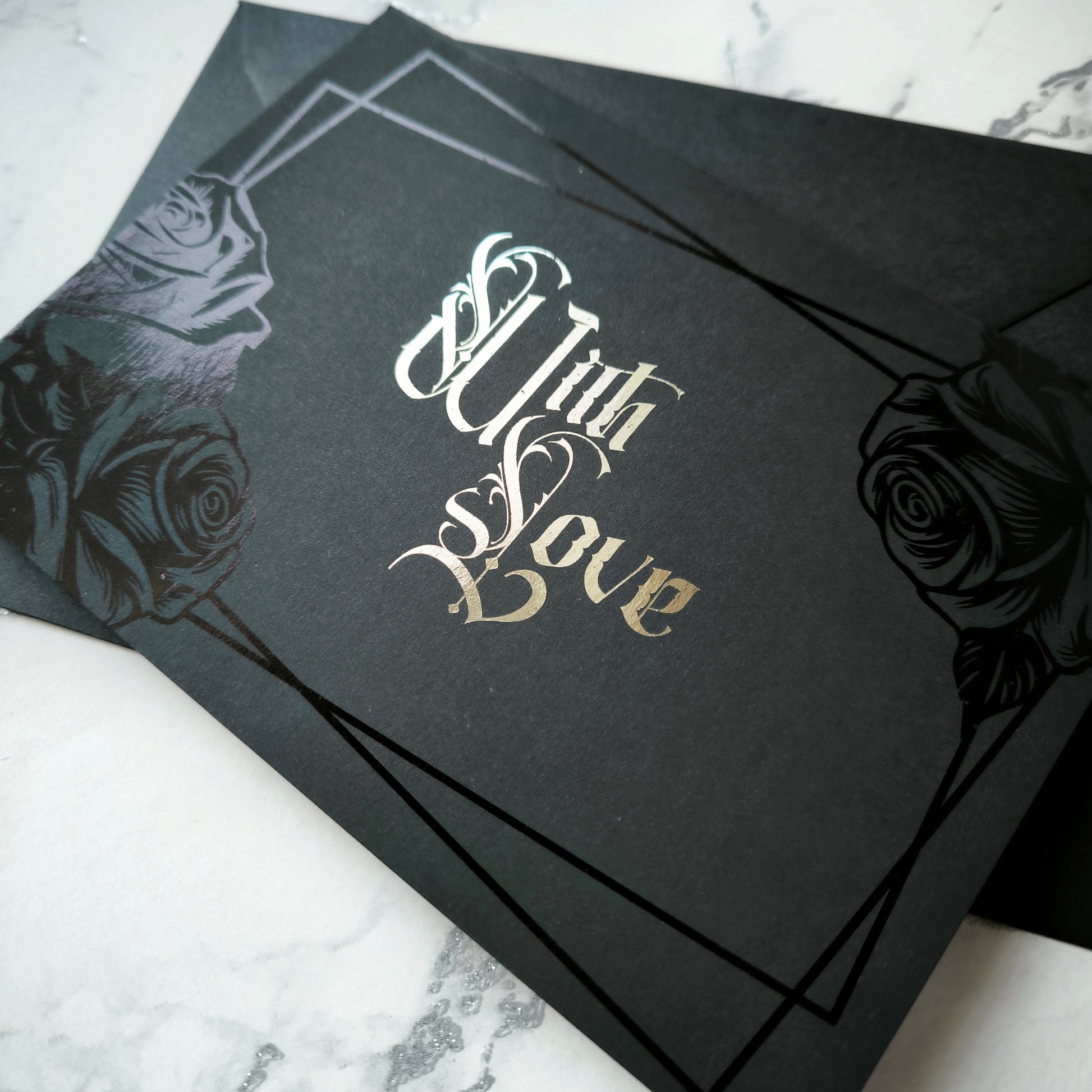 Black Rose Foiled With Love Card features deep black foiled roses and ornate silver foiled Victorian lettering reading “With Love.” 